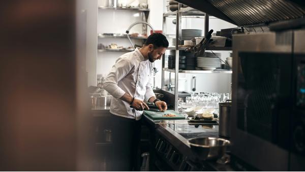Chef in food business's kitchen