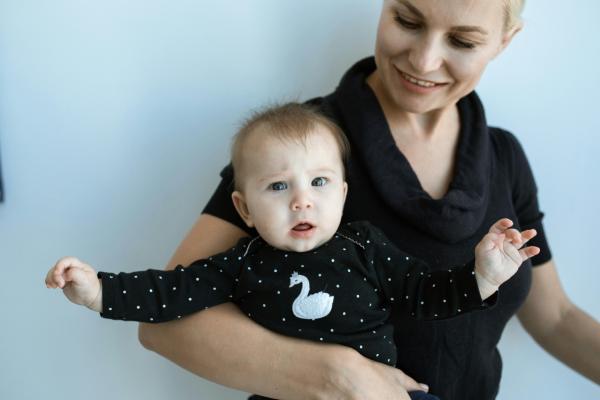 Childcarer holding baby