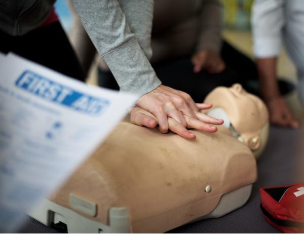 Trainer teaching CPR techniques