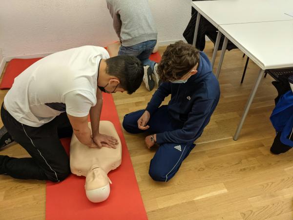 Man demonstrating CPR on manikin