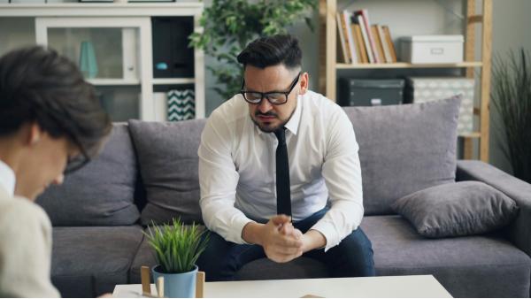 Man stressed on couch