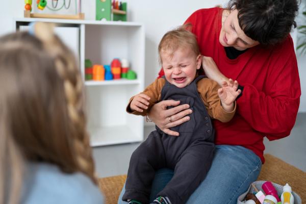 teacher looking after sick child