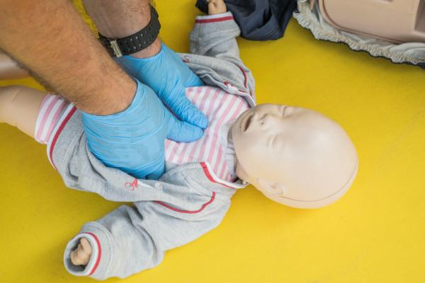 Trainer with child CPR manikin
