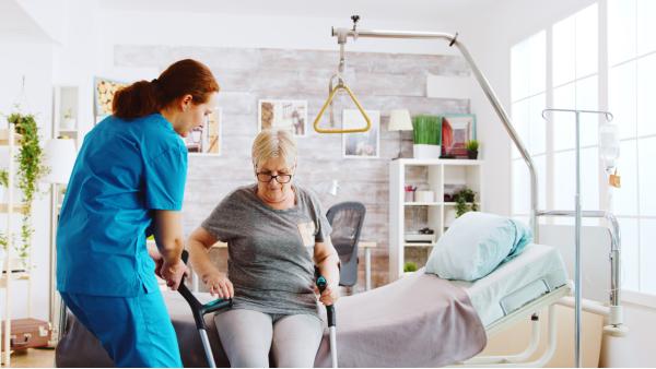 Healthcare worker handling patient