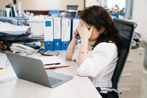 Woman stressed at her desk