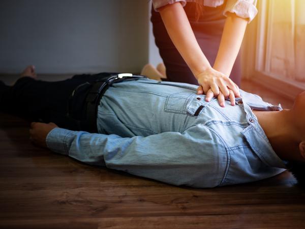 Women using CPR in office
